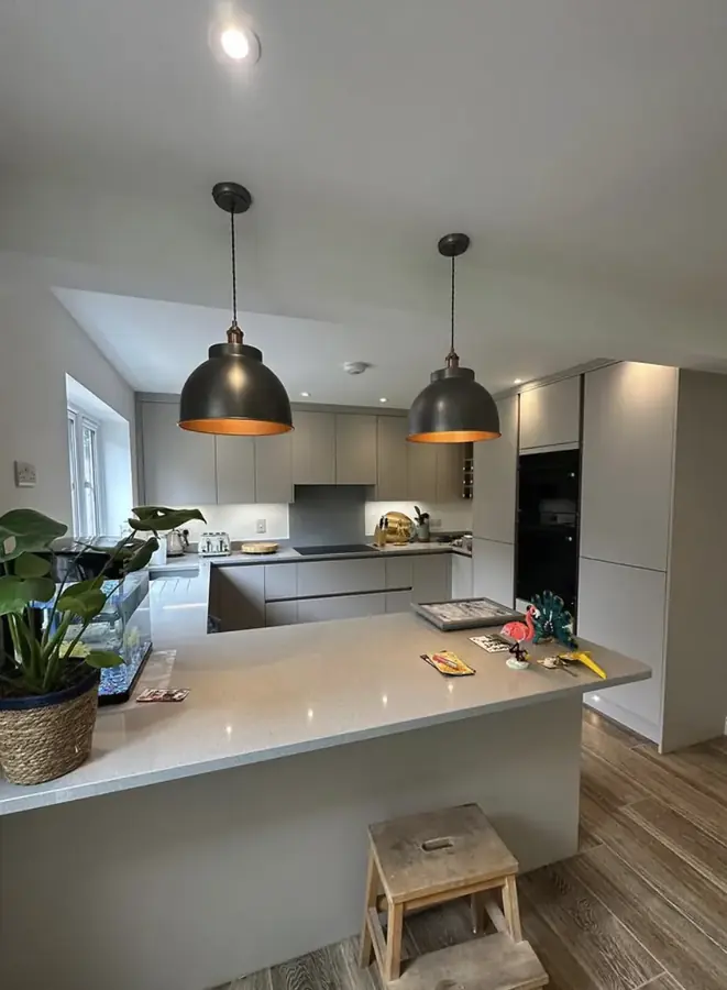 Pendant lighting over a kitchen peninsula