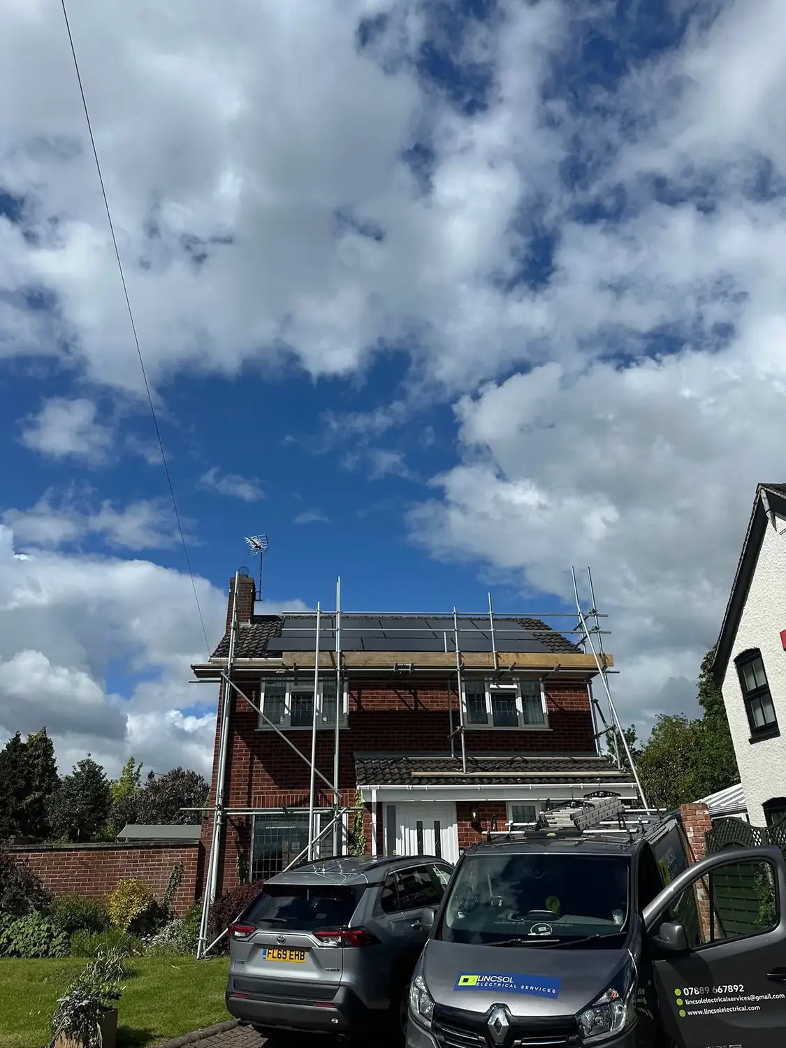 The Lincsol Electrical Services van outside a Lincoln house having solar panels fitted