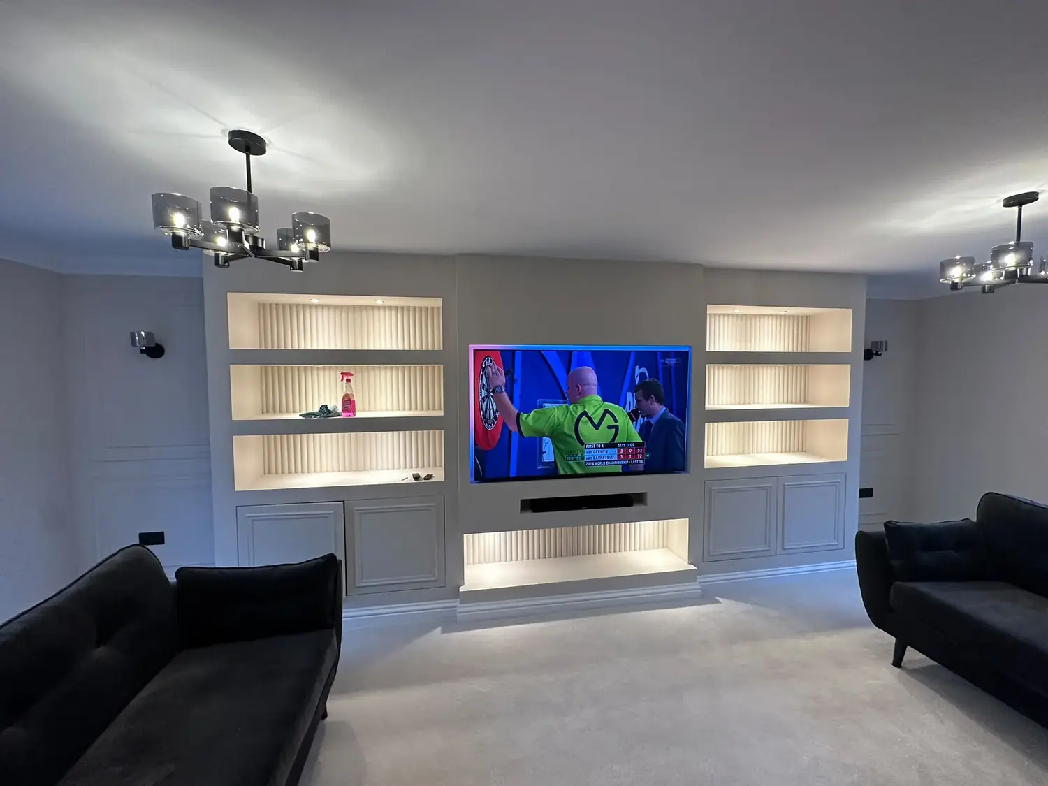 A lit media wall and lounge lighting in a Lincoln home