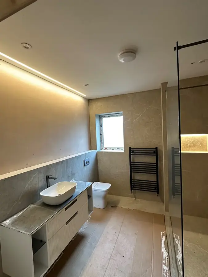 Bathroom lighting and a heated towel rail