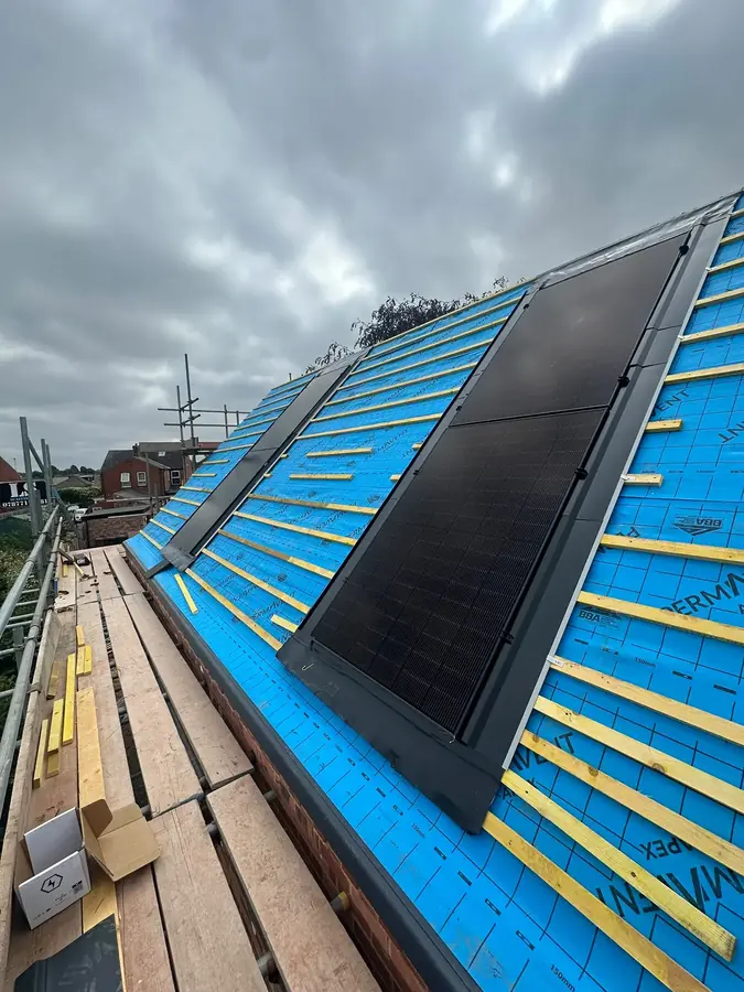 Solar panels being fitted to a roof in Lincoln